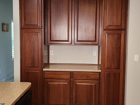 Beautiful built in cabinets with a nice "Coffee Bar" or "Bar space.