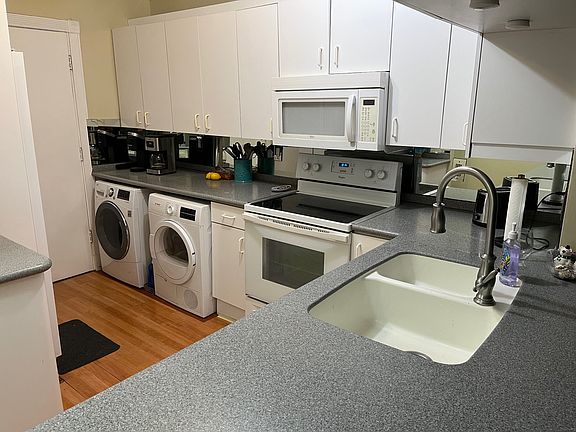 Kitchen includes coffee maker, Keurig, toaster, crock pot, waffle iron and plenty of dishware, silverware and cooking utensils.