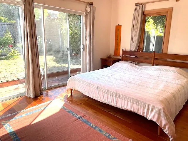 Master bedroom facing backyard and side yard