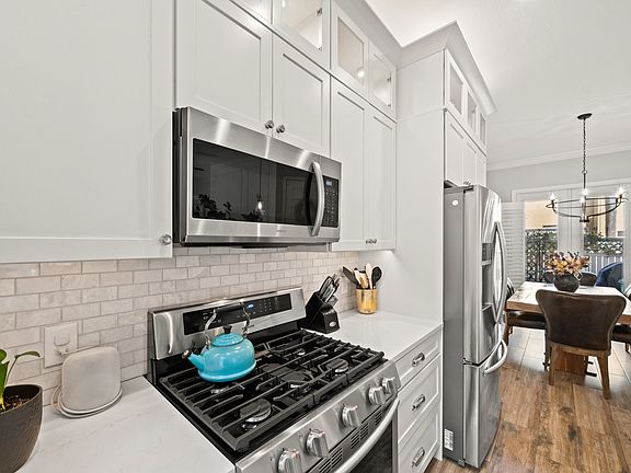 Open concept living space. Kitchen with high-end appliances and finishes.