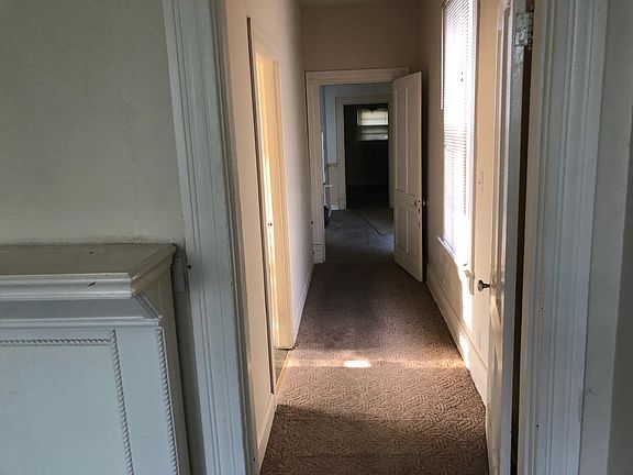 Hall way to bedroom, den, and kitchen 