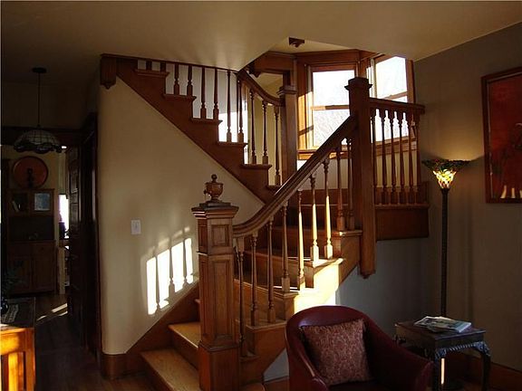 Stairs up to Second Floor, Butler's Pantry and Kitchen in background.