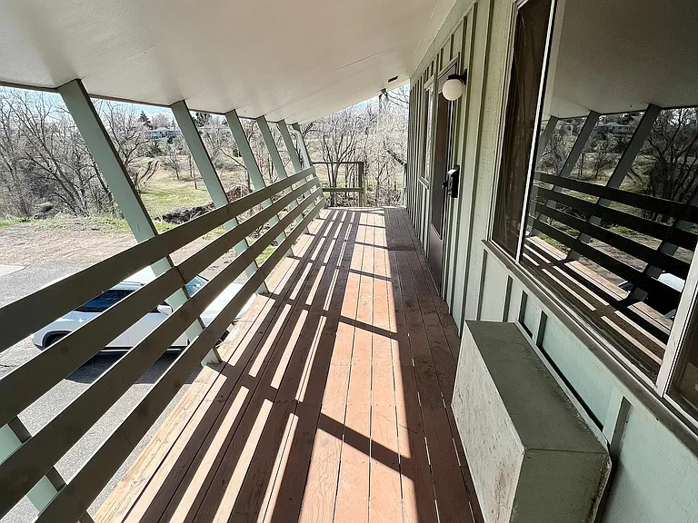 Step out onto this serene balcony and enjoy the tranquility of nature.
