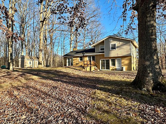 view of the back of the house and larger out building