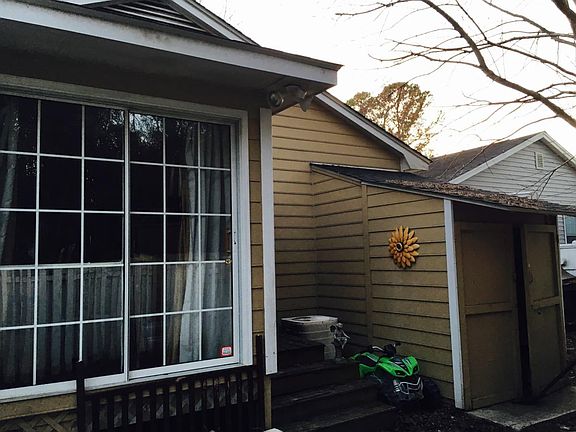 Back of home/sunroom off master and outdoor shed