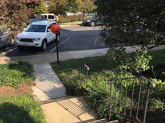 Walkway to parking lot directly by house.