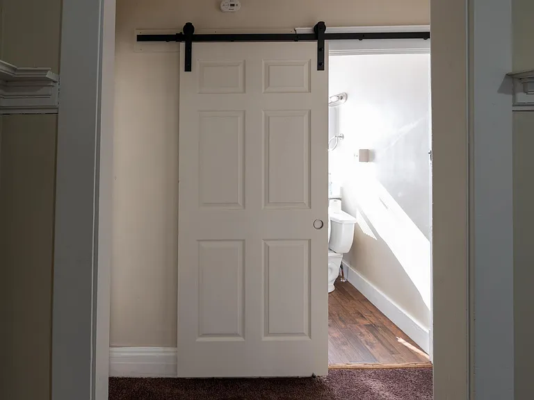 Barn door to bathroom