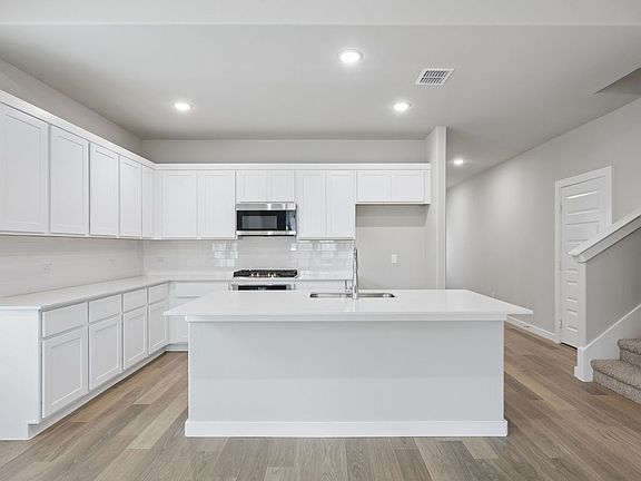 Kitchen in the Stanley II home plan by Trophy Signature Homes - REPRESENTATIVE PHOTO