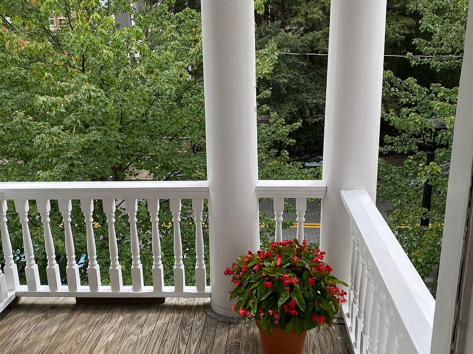 Private covered balcony off front bedroom
