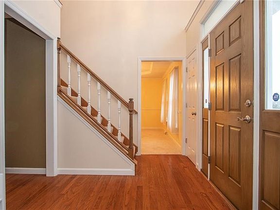 A 2 story 11X7 foyer with hardwood floors introduces guests to a center hall floor plan where easy access can be made to every r