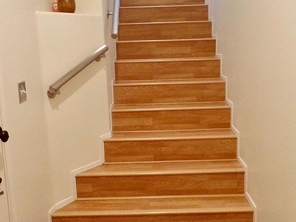 Stairwell from front door leading to the living room.
