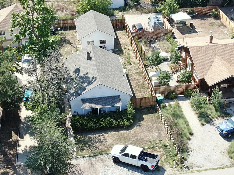 Aerial of front yard with off-street parking and new privacy fence