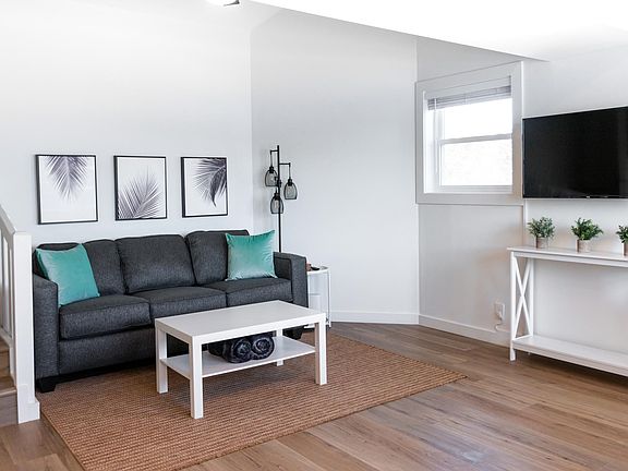 Enjoy the cozy living room with Roku TV including Hulu, Disney+ & ESPN+