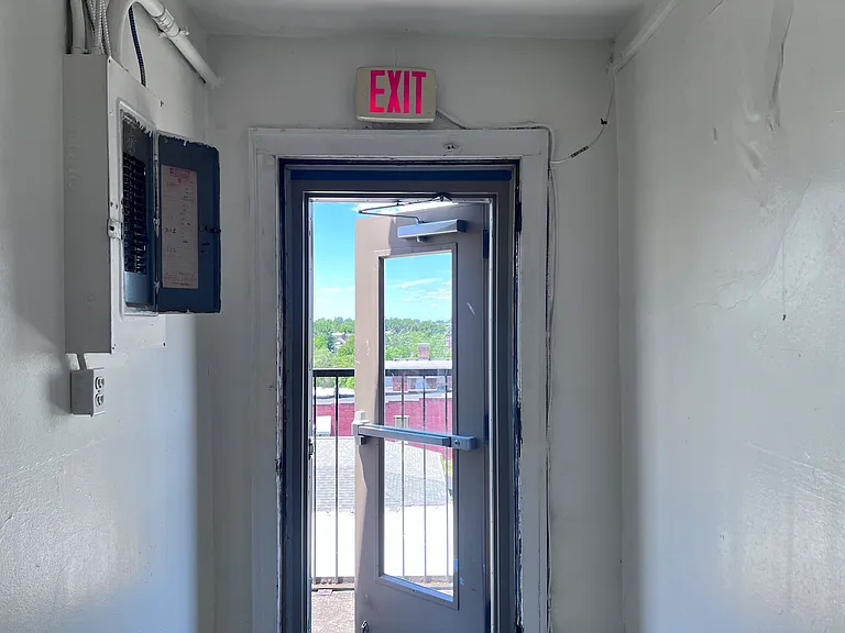 Fire escape exit. This will also lead down to the dumpsters for added convenience.