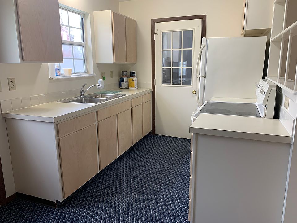 Bright kitchen with door to garage. Convienent to carry in those groceries