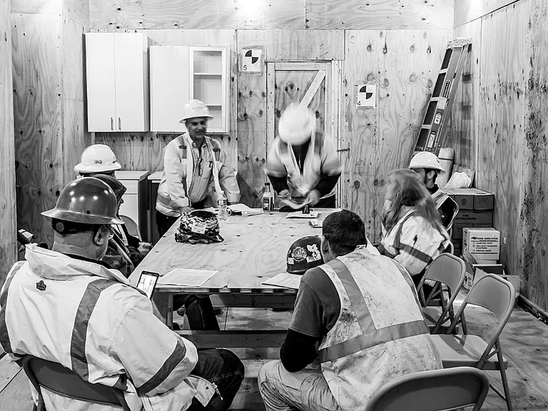 During Renovation: Construction team meeting during the now-completed renovation project of the building