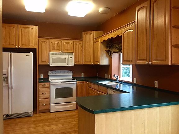 Kitchen: hickory & corian counters.
