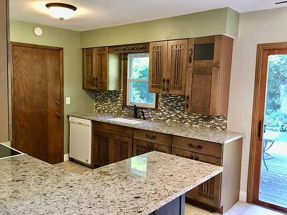 Remodeled kitchen with granite tops alder cabinets and newer appliances
