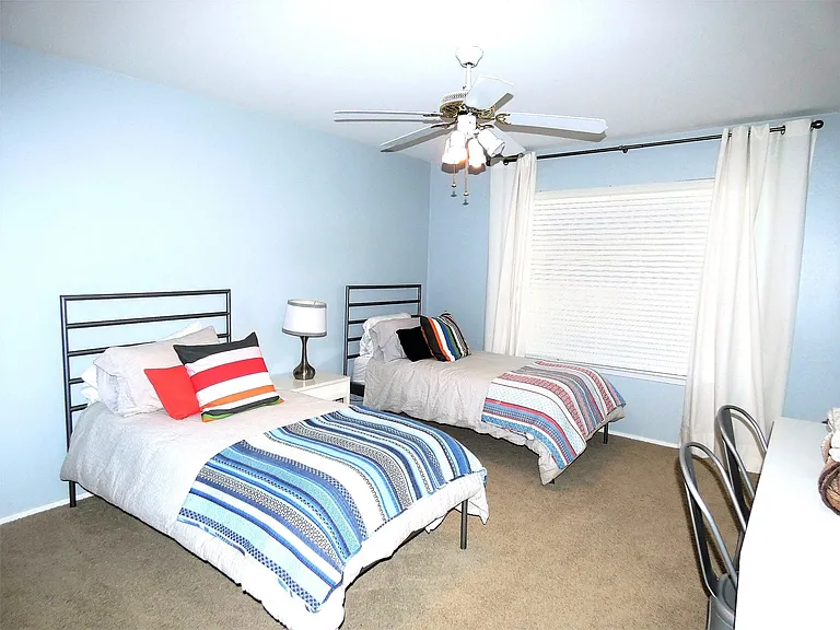 The second bedroom has two twin beds and private bath.