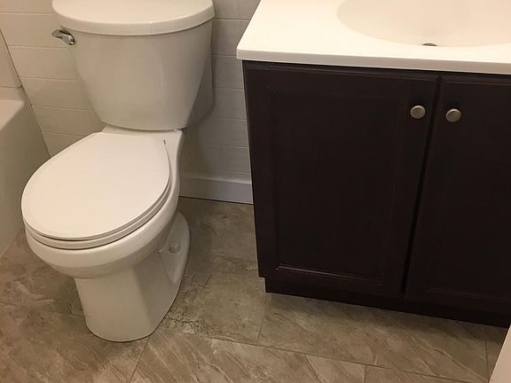 Brand new Ceramic tile flooring, toilet, sink basin & sink.