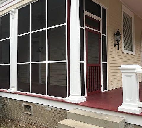 view of screen porch from parking area. Plenty of on site parking steps away from this screened porch entry.