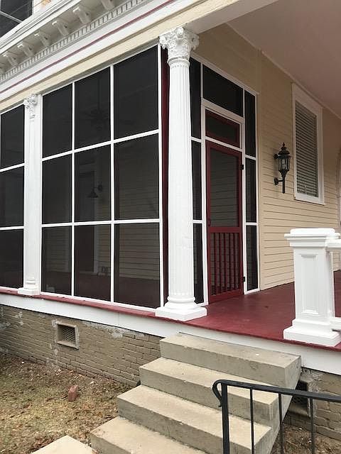 view of screen porch from parking area. Plenty of on site parking steps away from this screened porch entry.