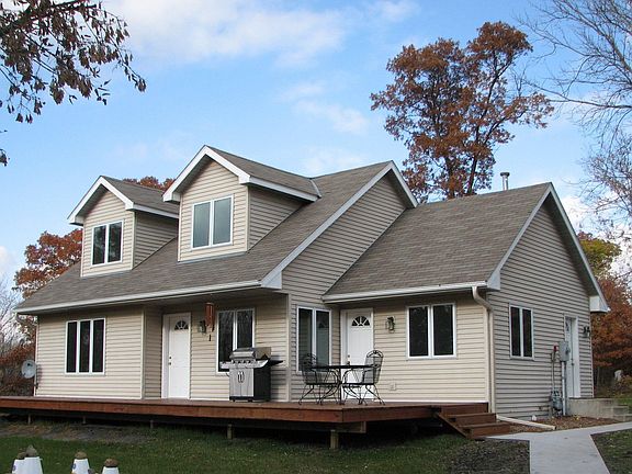 Contemporary 1 1/2 story on 9.3 Wooded Acres!