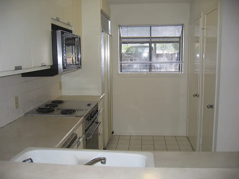Laundry closet and pantry open from the kitchen