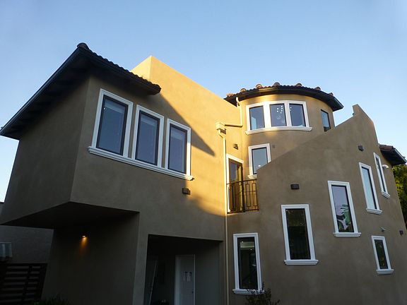 Curved stairway from 2nd floor up to private rooftop patio