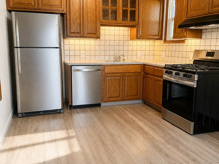 Kitchen with new appliances, dishwasher, gas stove, vent, and energy efficient appliances in a sunny bright setting.