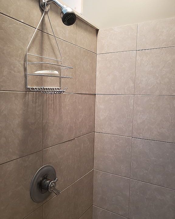 Completely tiled sitting shower
