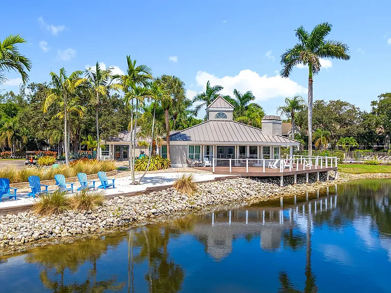 Relax lakeside with unbeatable views of our waterfront clubhouse at River Reach Apartments. From the wraparound deck to the beach-style seating, this serene space offers the perfect escape just steps from home.