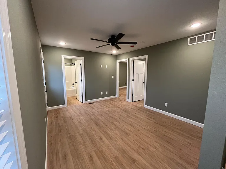 Second level living area leading into 2 additional bedrooms and second full bathroom