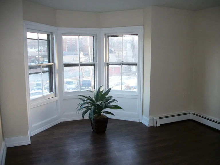 Three corner windows in bedroom