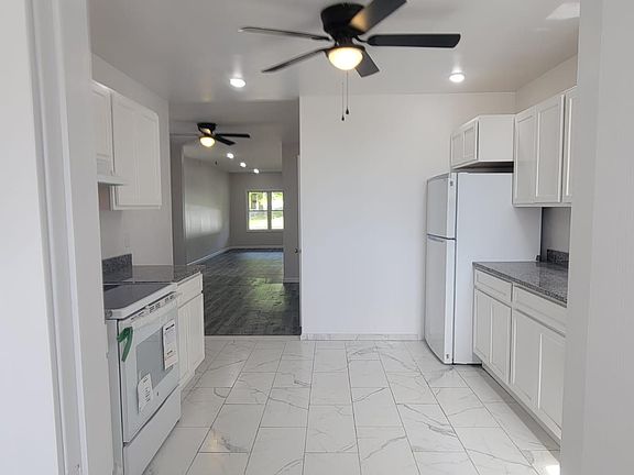 Ceiling fans in all rooms! Huge kitchen right off dining and living rooms.