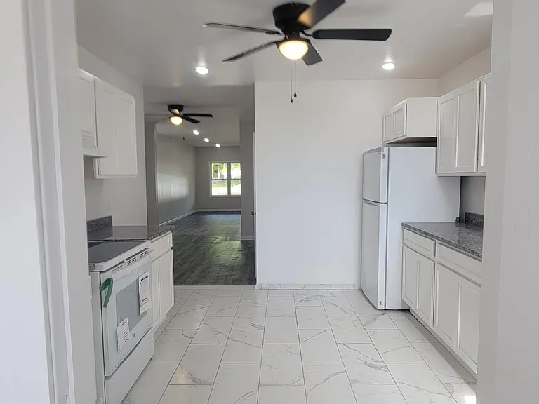 Ceiling fans in all rooms! Huge kitchen right off dining and living rooms.