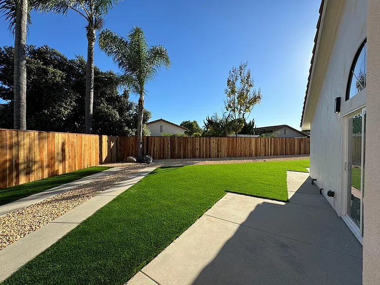 Immaculately landscaped yard with fenced in backyard. Solar panels for your utilities, Brand new roof,