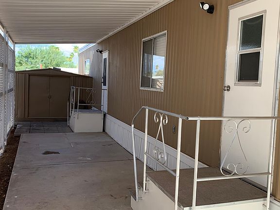 Shaded patio, storage in back