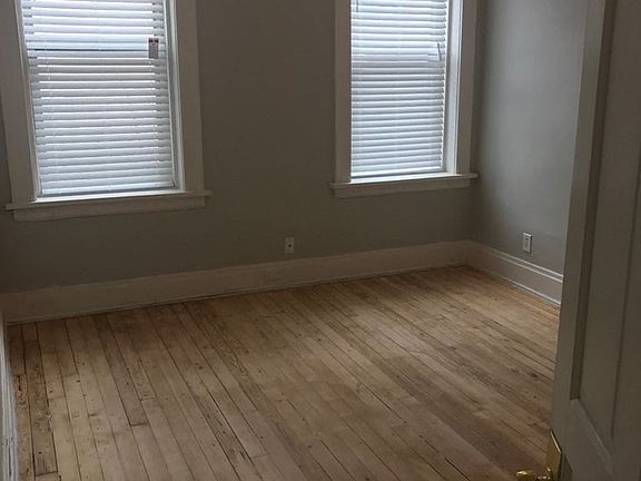 Bedroom - Gray Turnover & Hardwood Floor