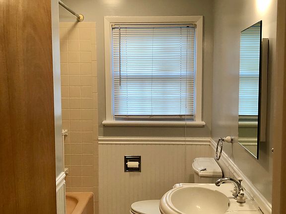 Full bath with linen closet.