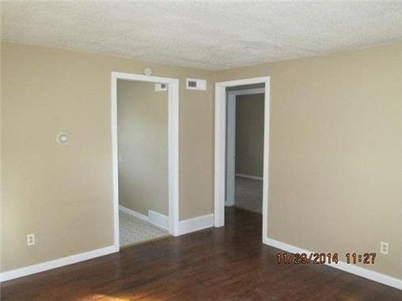 living room, entrance to hall and kitchen