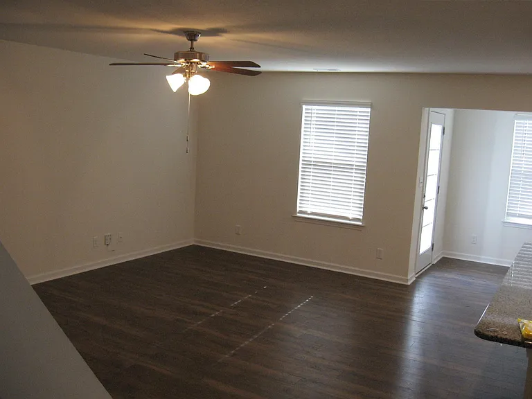 Large living area with ceiling fan