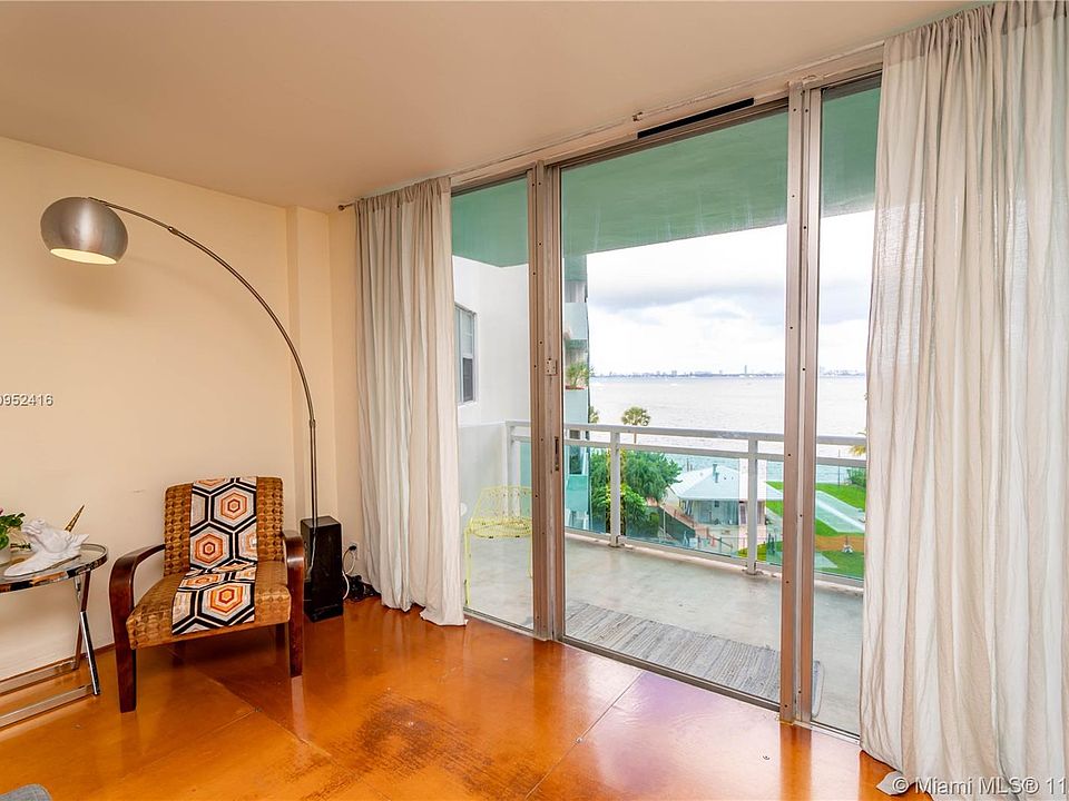 Living Room view of Balcony, Cabana and Bay