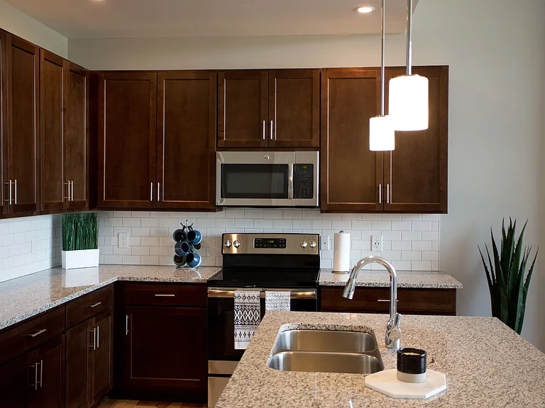 Kitchen with espresso cabinets and stainless appliances