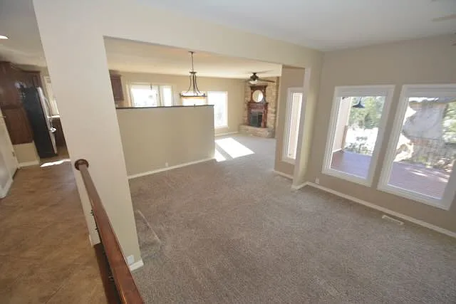 Living room, looking toward dining room and fireplace