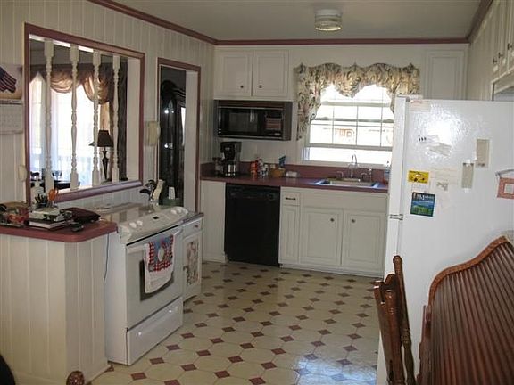 The sellers opened the kitchen wall up to the living room to be very open.