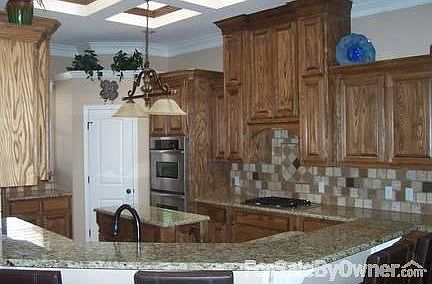 Upgraded cabinets, tile and granite
						:
						Eat-at counter, beautiful skylight, walk-in pantry and crown molding.