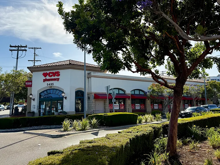 CVS across the street with a pharmacy, grocery items, and wine/beer/liquor selections