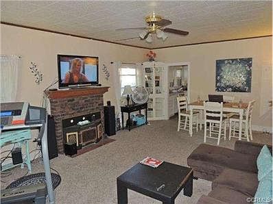 Living room and dining area have newer carpeting.