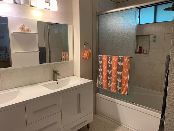 Dual sink Master bathroom with rain shower over 2 person tub